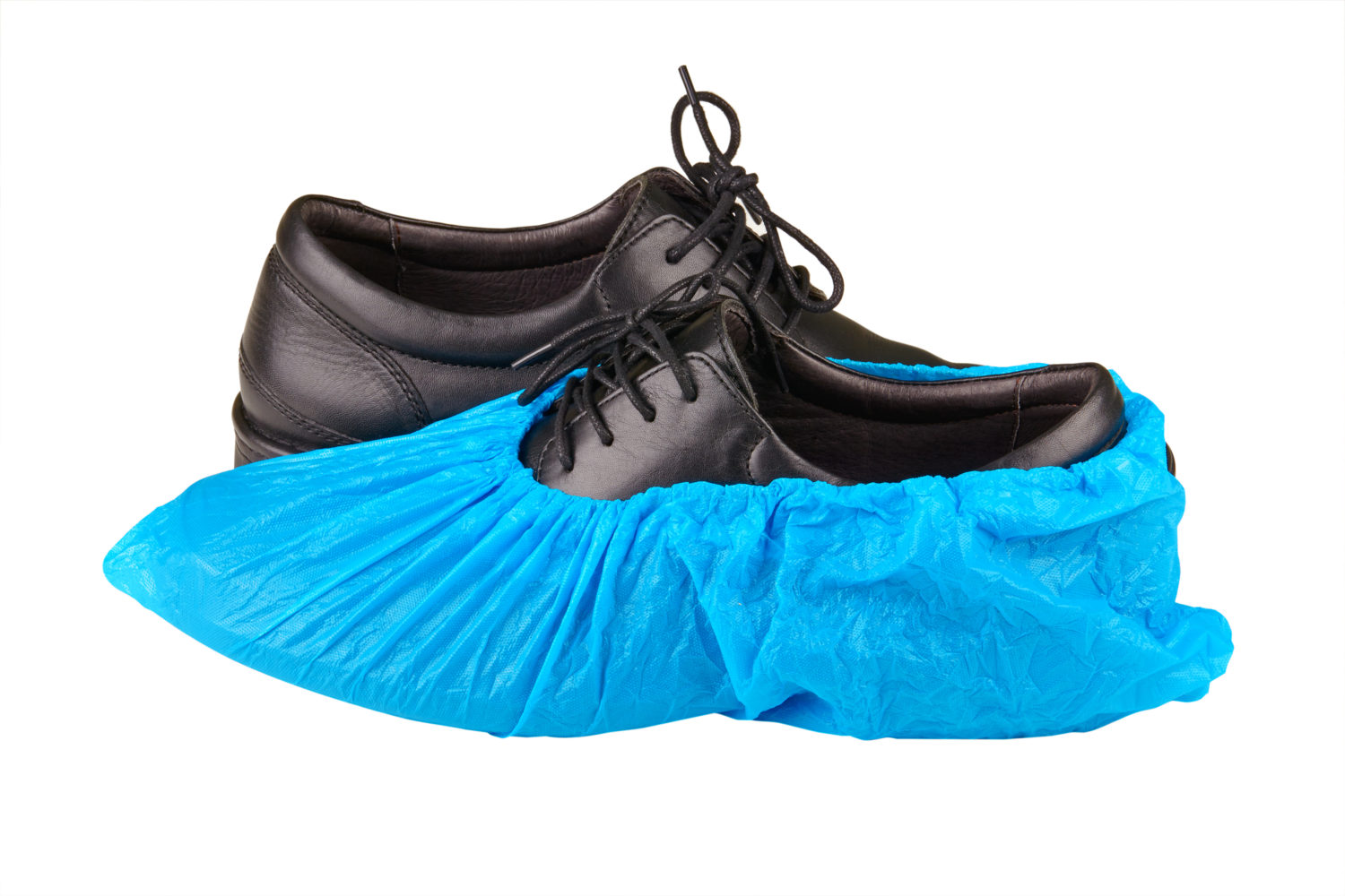Black medical shoes with blue protective covers.