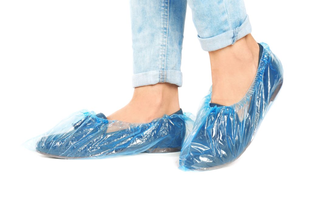 Kris Jenner wearing shoe covers on her flats to protect her hardwood floors.