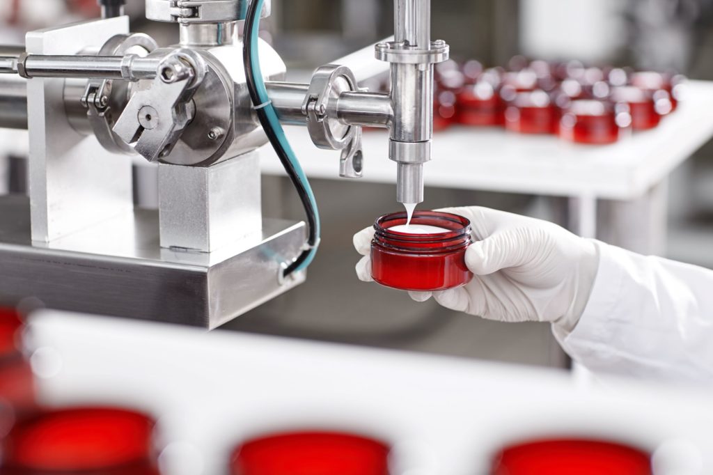 Cosmetic industry packaging requires sanitation and protective gear.