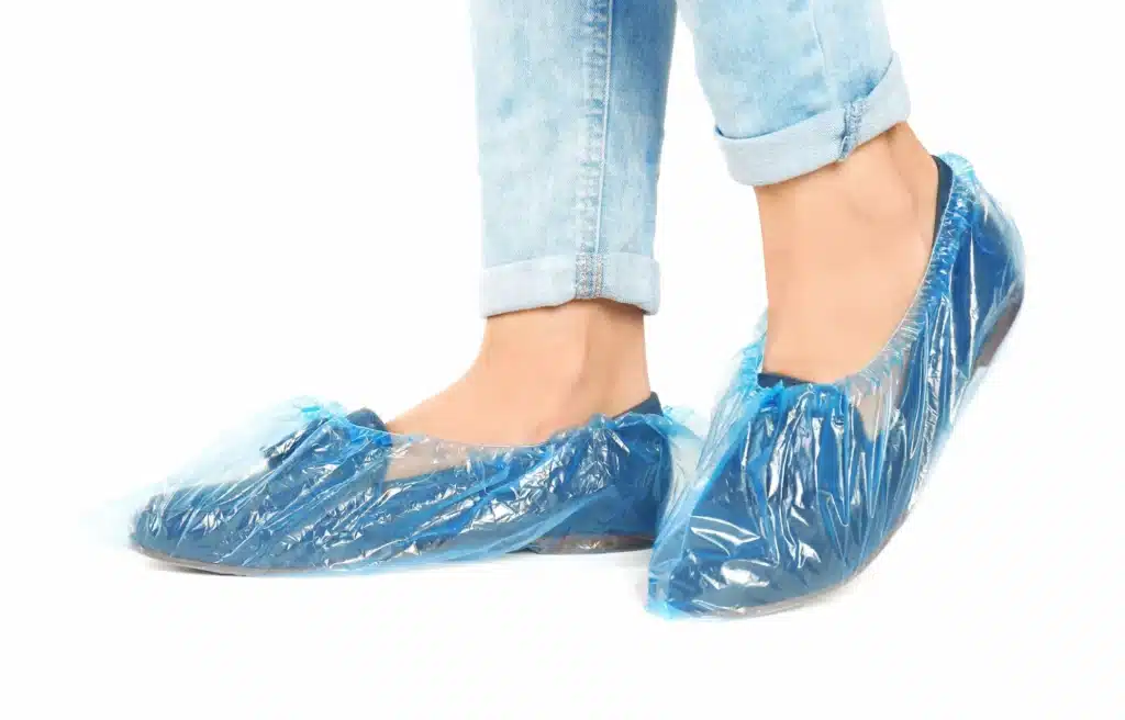 Kris Jenner wearing shoe covers on her flats to protect her hardwood floors.